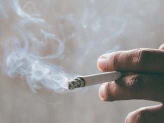 Smoking cigarettes tobacco in hand with a soft focus. concept quit cigarettes are dangerous to health.