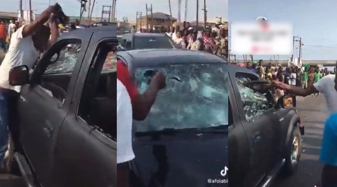 two-men-smash-car.x42149